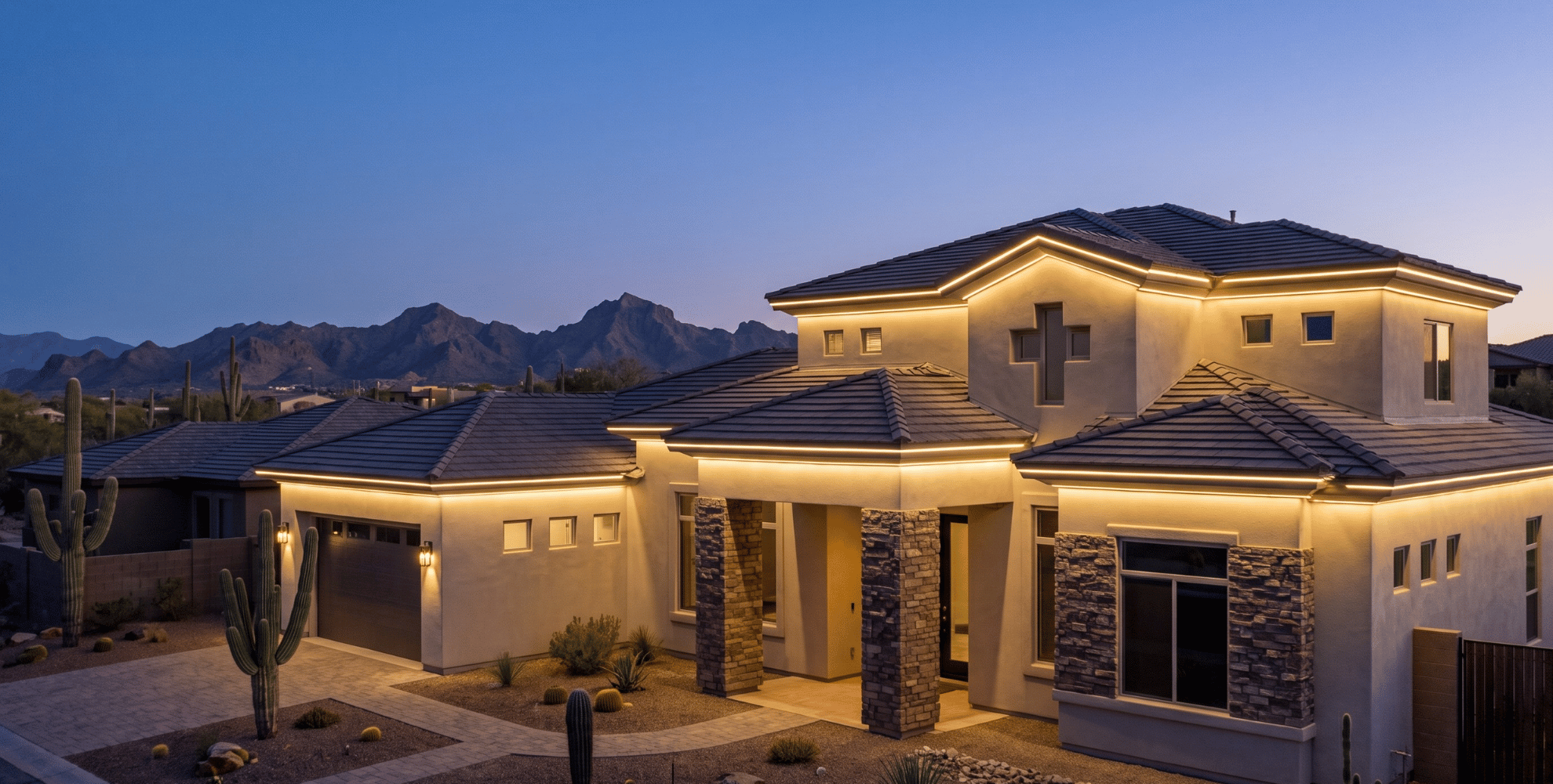 After — home with architectural roofline lighting on at dusk